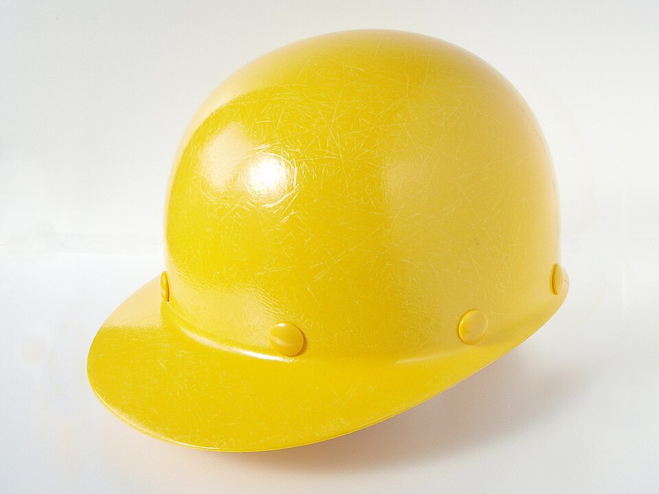 Illustrative photograph of a yellow construction helmet